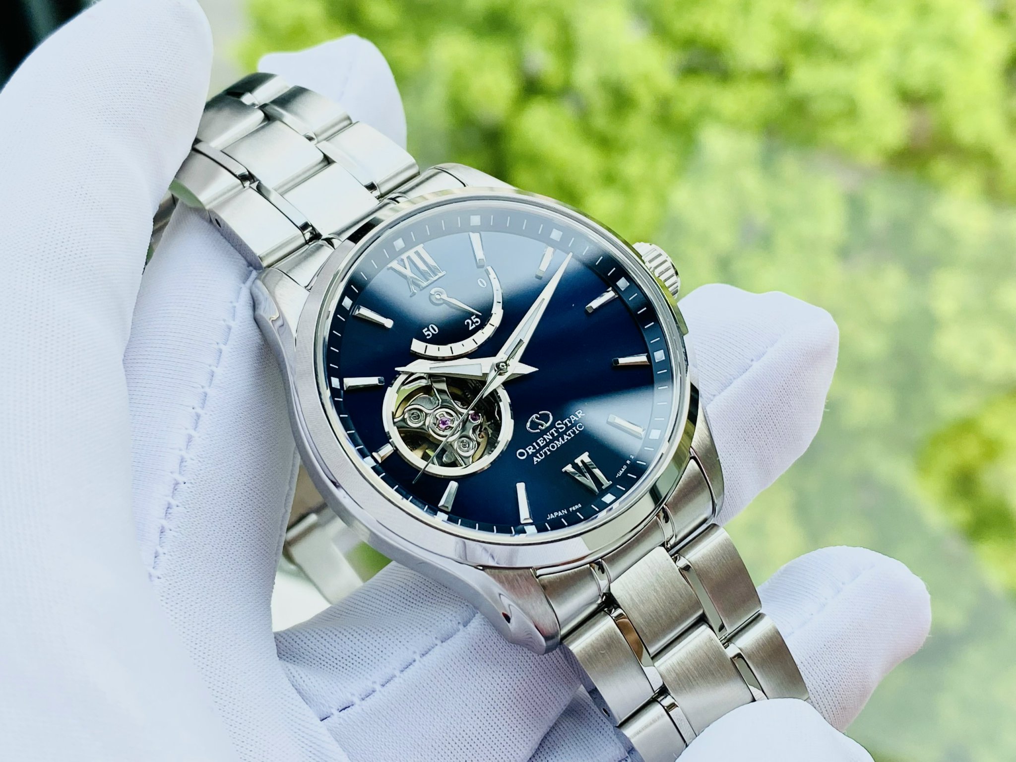 Đồng hồ nam Orient Star Automatic Open Heart Blue Dial Silver Tone Men’s Watch RE-AT0001L00B